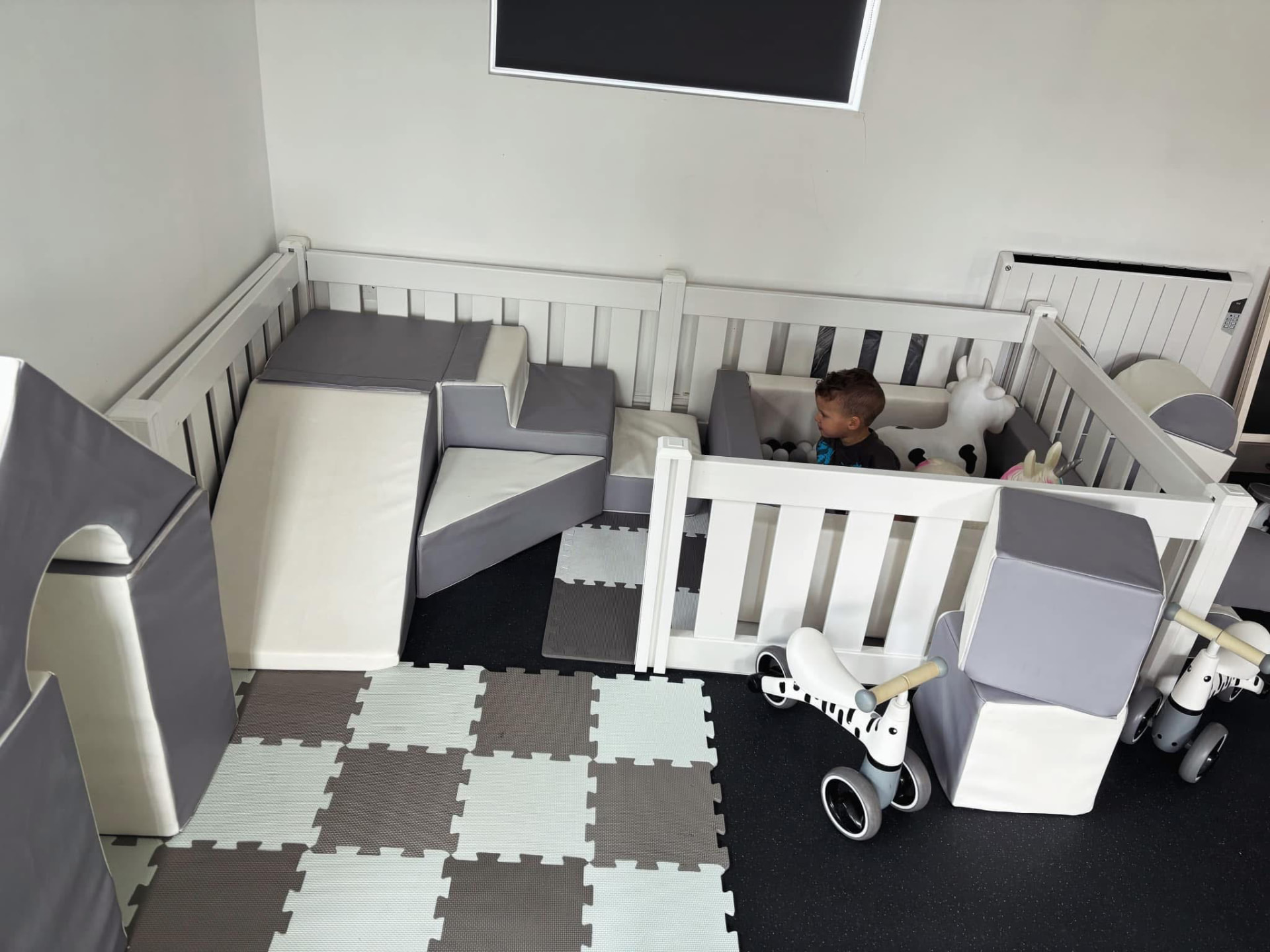 Stylish grey and white soft play setup by Soft Play Spectacular